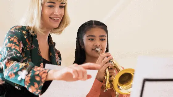 first private lesson girl playing trumpet