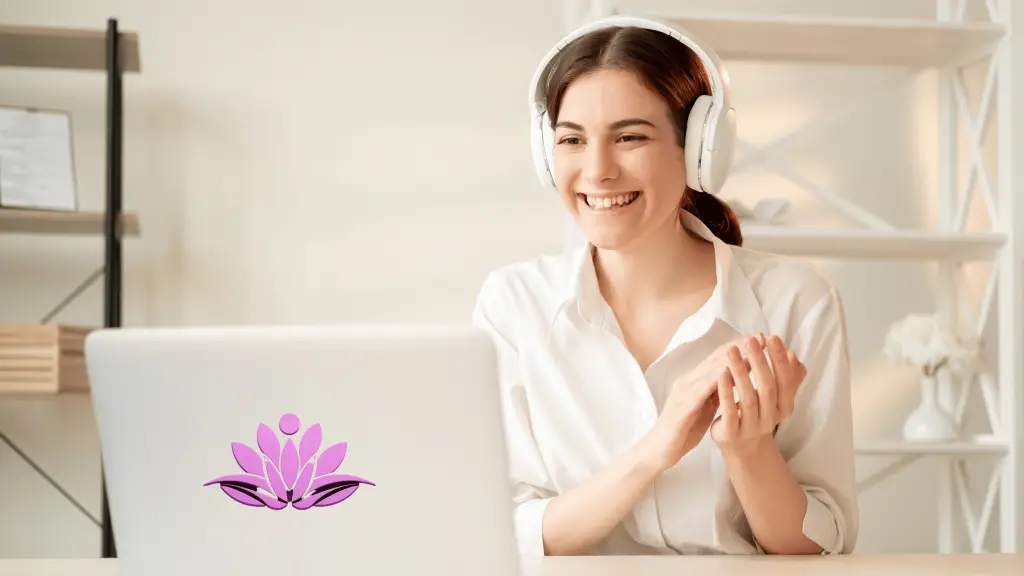 Female business coach sitting in front of the computer